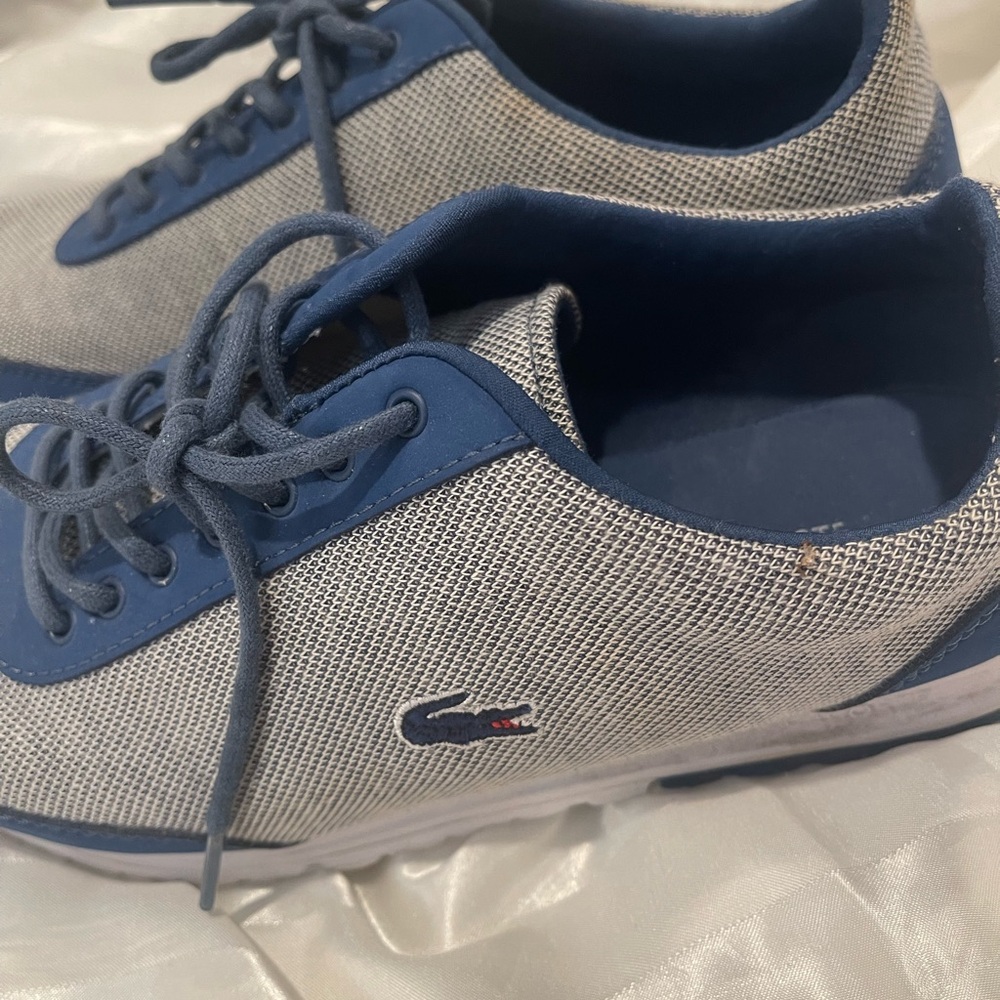 Lacoste blue sneakers size 7 

Comes in original box.